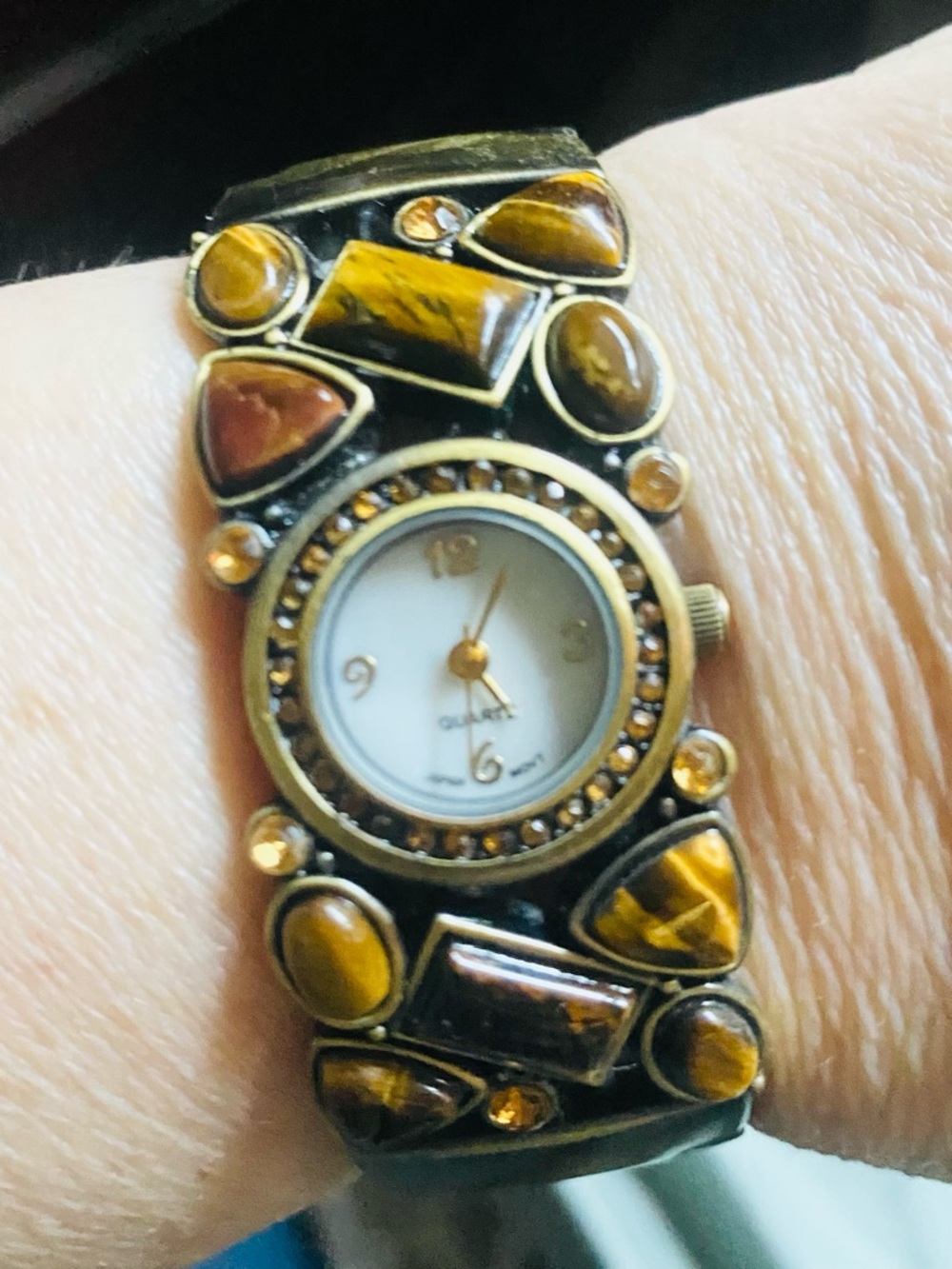 Vintage style women's quartz cuff watch featuring tigers eye stones.
